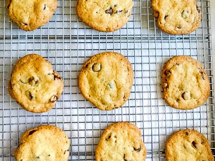9 chocolate chip cookies on a wire rack.