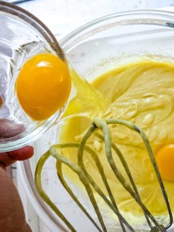eggs in cake mix in glass bowl