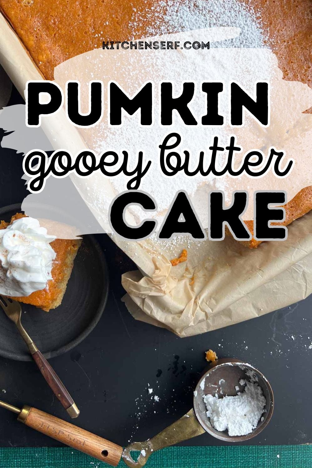 pumpkin gooey butter cake in a cake pan dusted with powdered sugar and a slice on a black plate topped with whipped cream. 