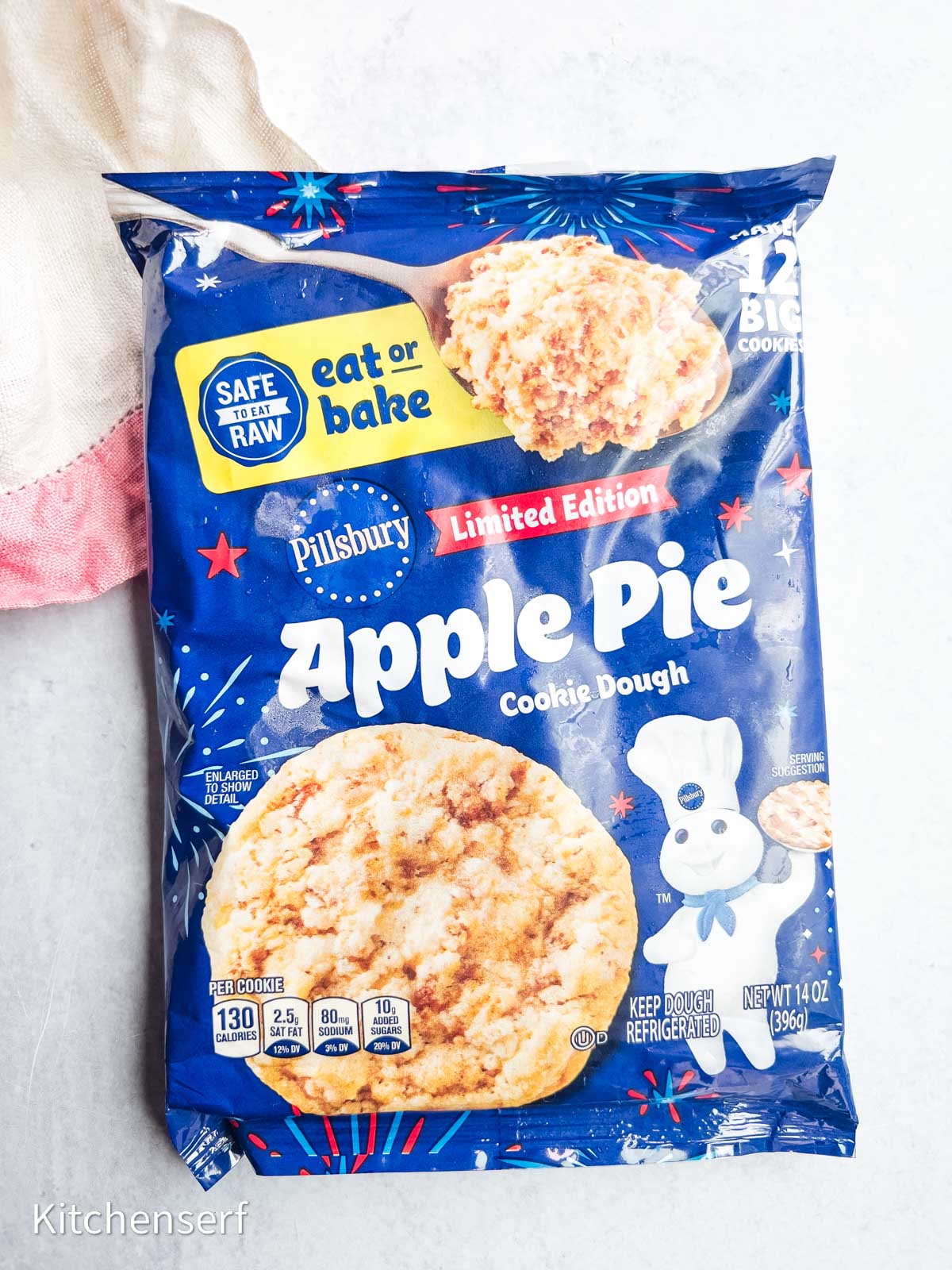 A blue package of Pillsbury Limited Edition Apple Pie Cookie Dough on a light surface.